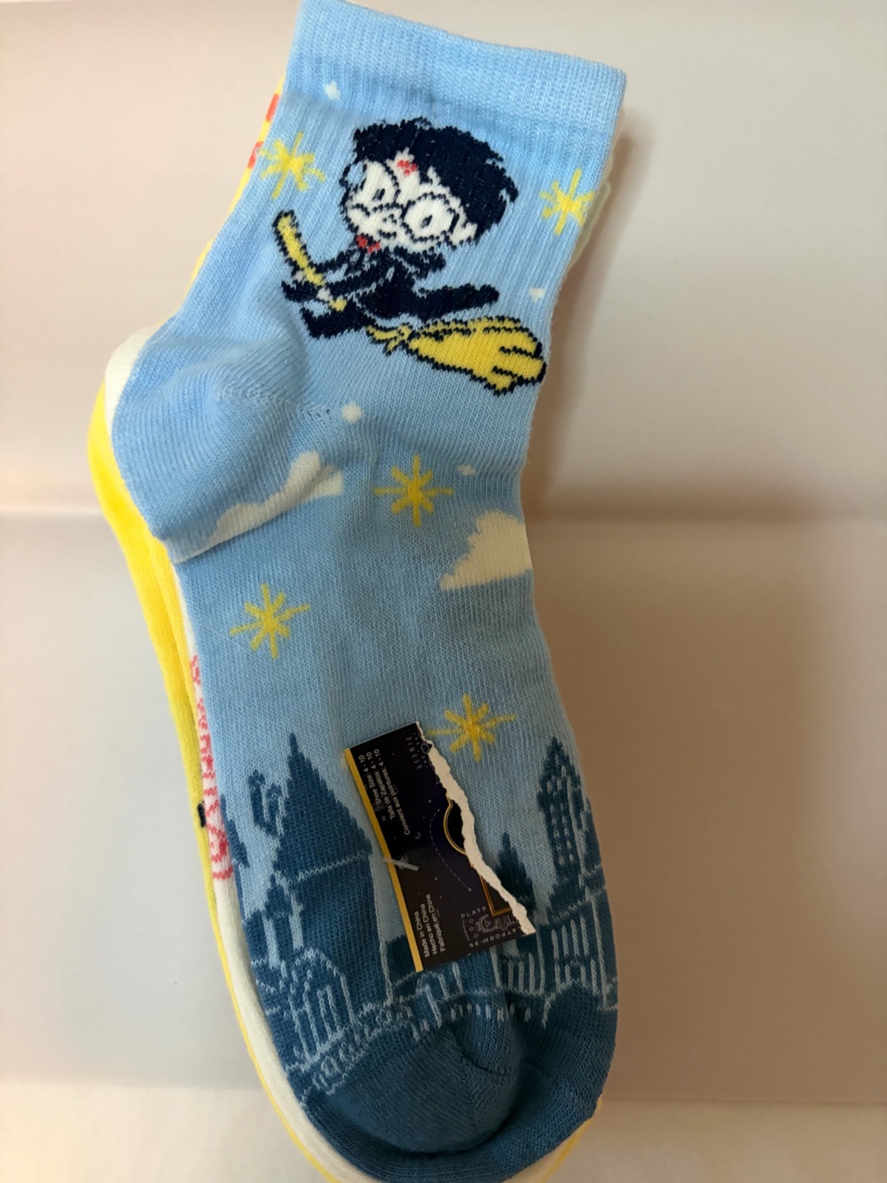Light Blue Novelty adult Crew Socks with Harry Potter characters.